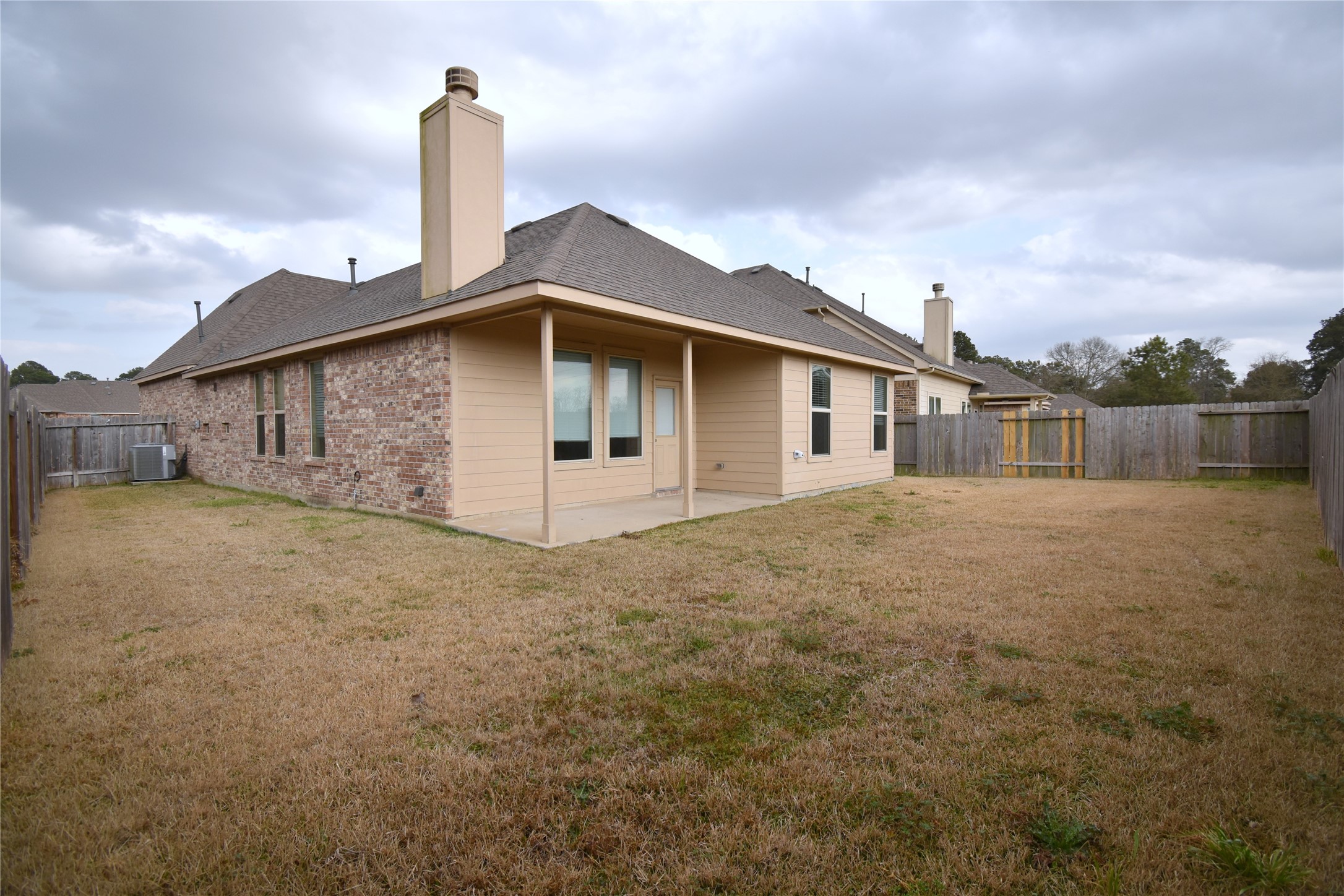 22219 Ebbets Field Drive Spring, TX 77389 - Photo 22 of 22 a house with trees in the background