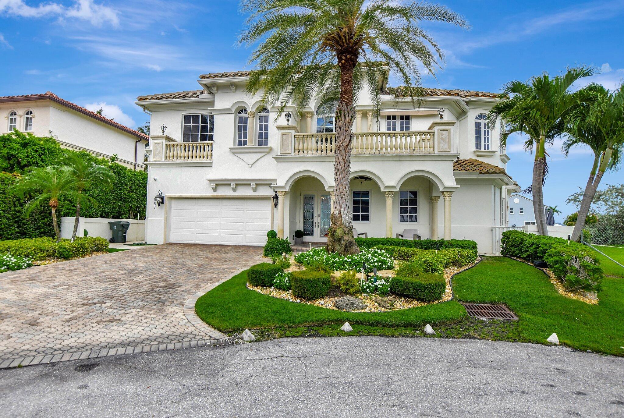 857 Havana Drive Boca Raton, FL 33487 - Photo 1 of 30 a front view of a house with a garden
