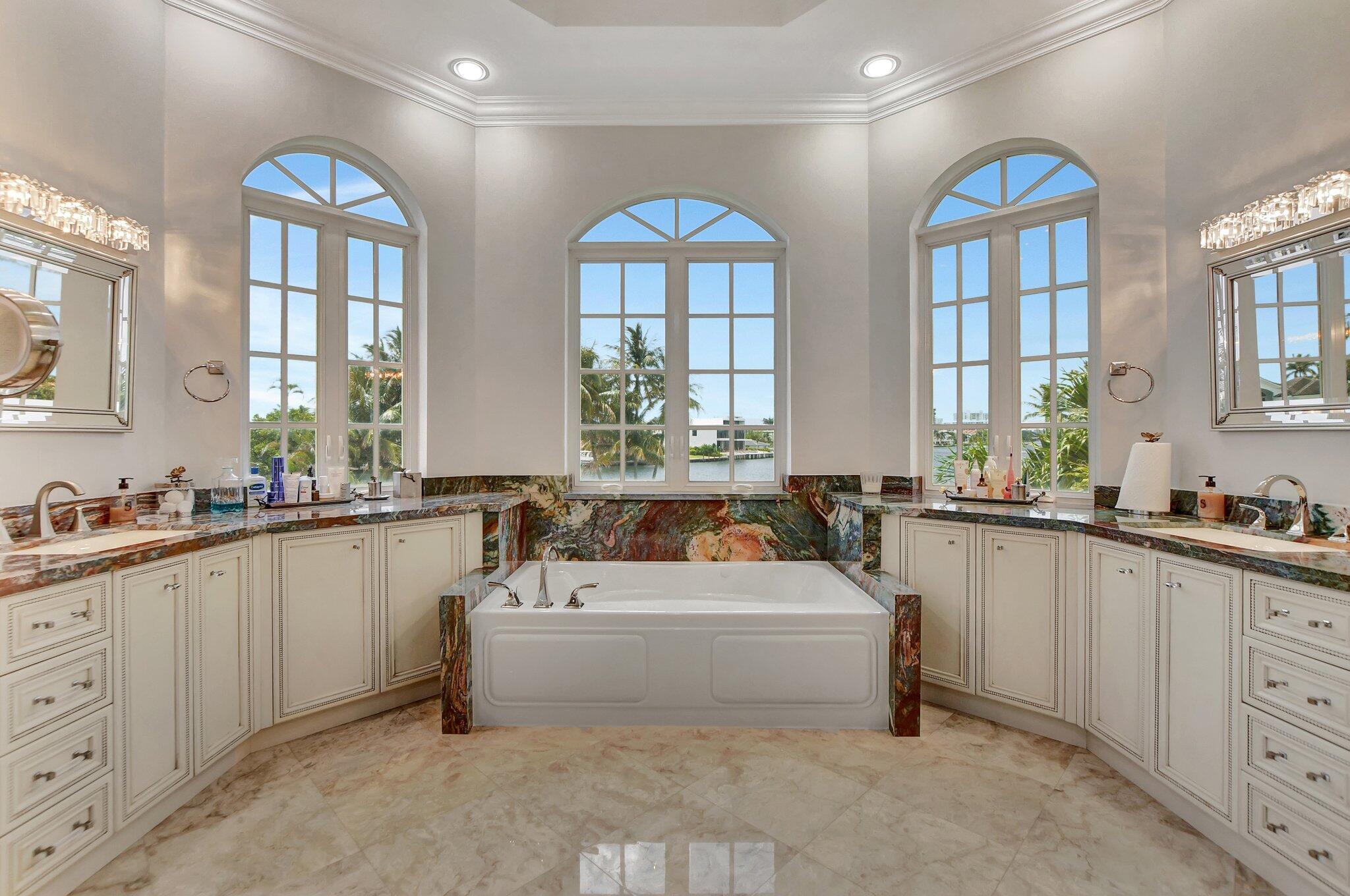 857 Havana Drive Boca Raton, FL 33487 - Photo 17 of 30 a large white kitchen with sink and window