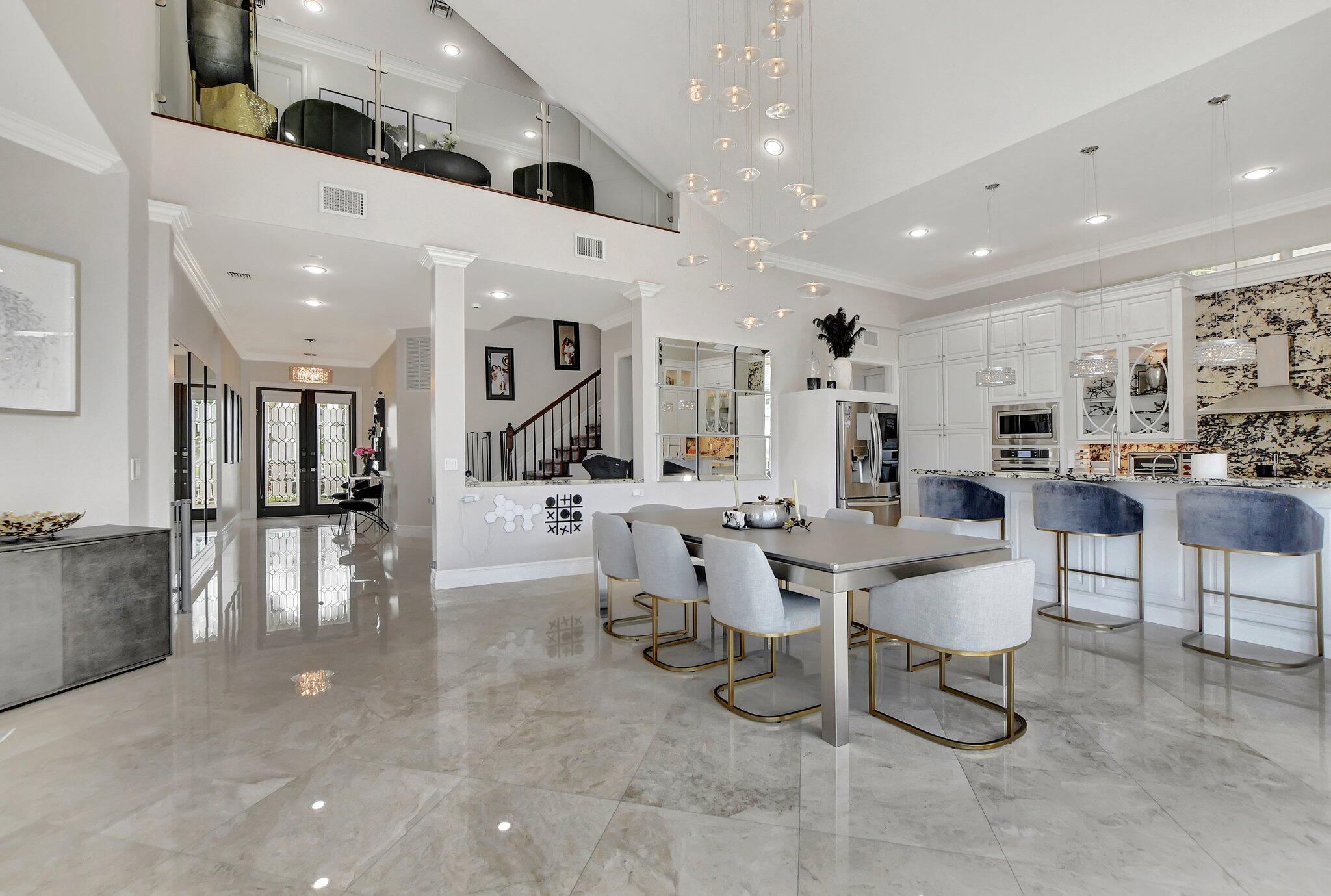 857 Havana Drive Boca Raton, FL 33487 - Photo 4 of 30 a large kitchen with a table and chairs