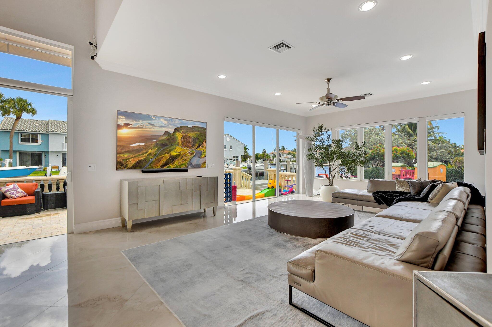 857 Havana Drive Boca Raton, FL 33487 - Photo 6 of 30 a living room with furniture and a flat screen tv