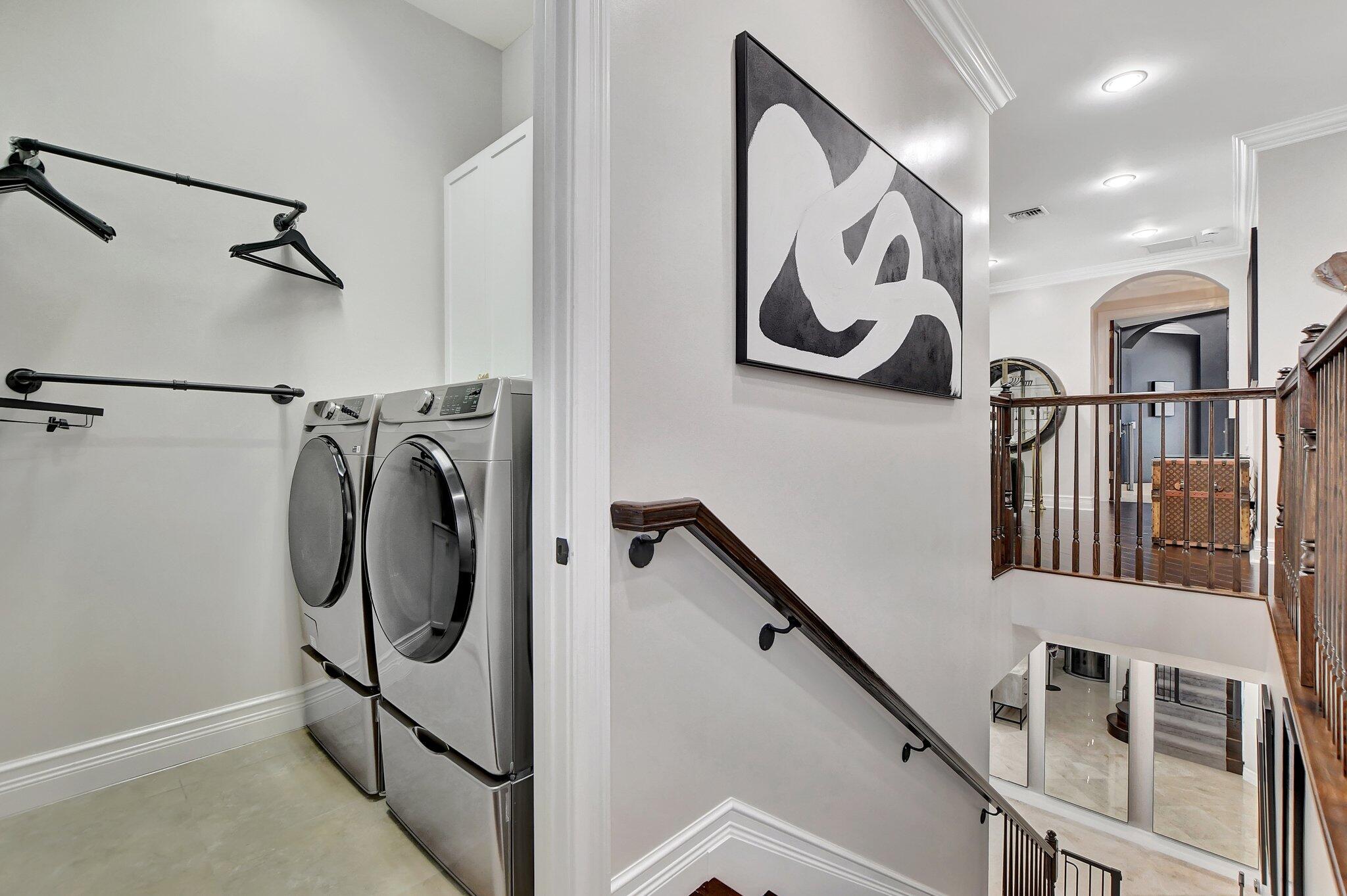 857 Havana Drive Boca Raton, FL 33487 - Photo 8 of 30 a view of a hallway with washer and dryer