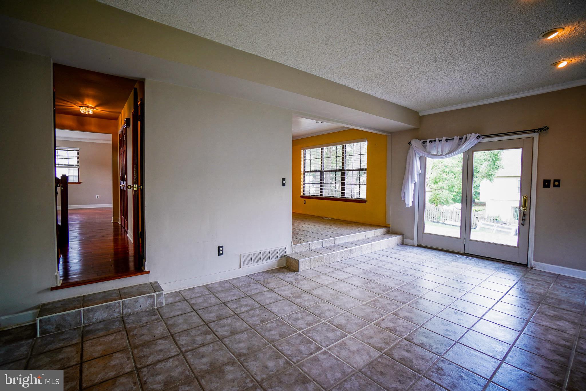 12 Blue Grass Road Clementon, NJ 08021 - Photo 12 of 23 wooden floor in an empty room with a window