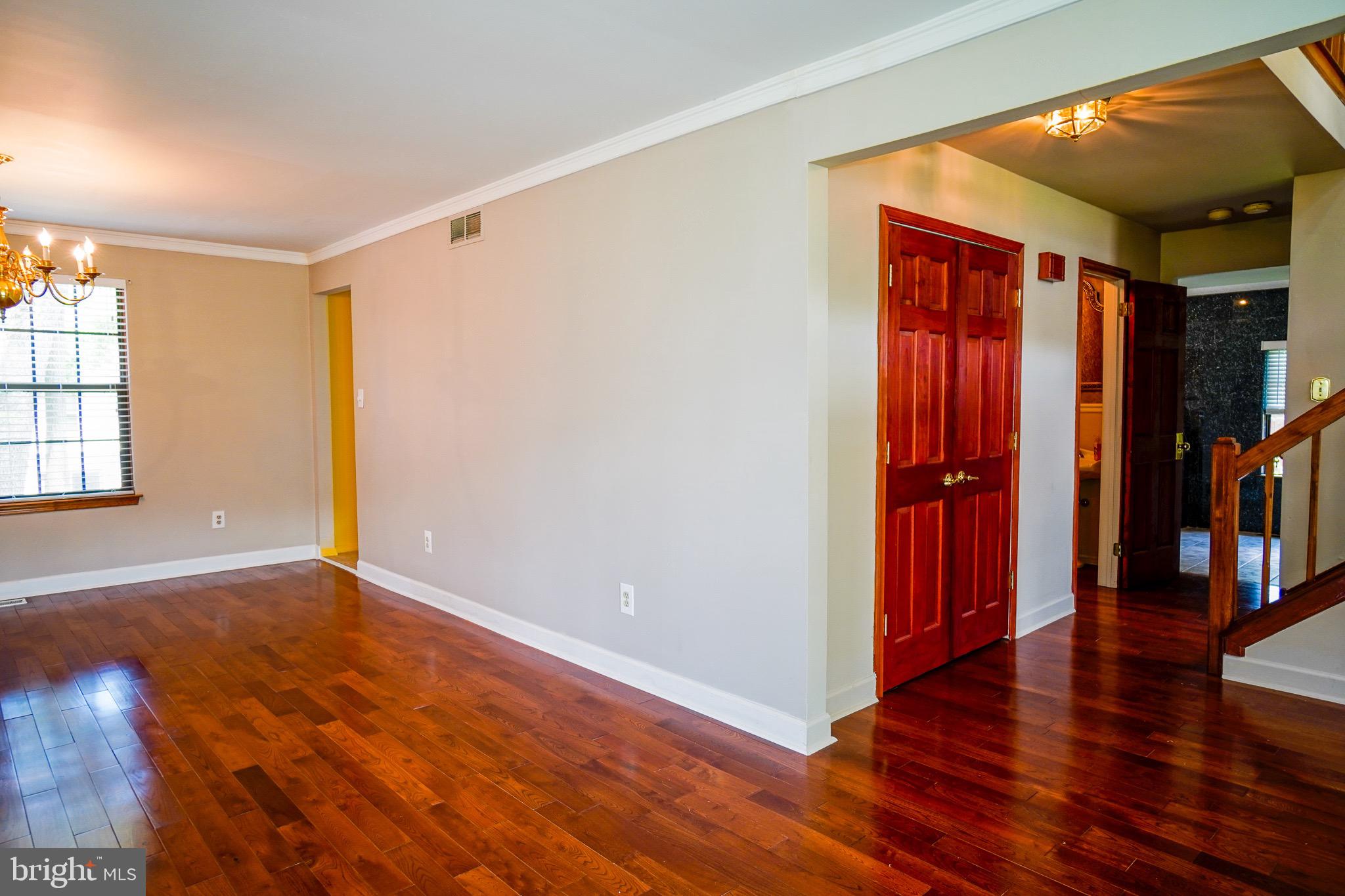 12 Blue Grass Road Clementon, NJ 08021 - Photo 5 of 23 wooden floor in an empty room with a window