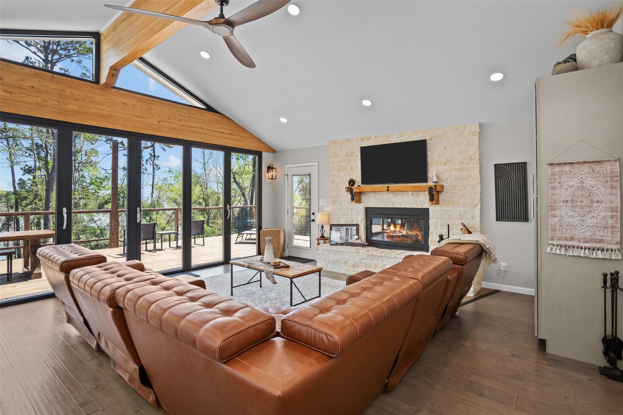 120 Cliff Street Point Blank, TX 77364 - Photo 1 of 30 Cozy family room with high ceilings and wood burning fireplace with view of Lake Livingston