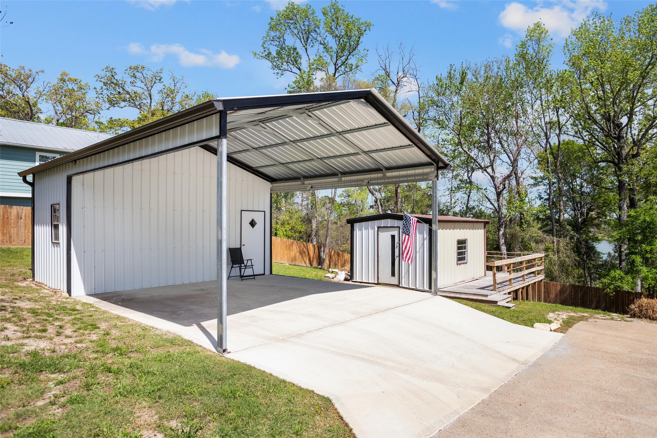 120 Cliff Street Point Blank, TX 77364 - Photo 22 of 30 Covered carport with extra storage shed attached