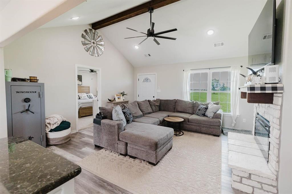 8615 North Fm 51 Decatur, TX 76234 - Photo 8 of 26 a living room with furniture and a chandelier