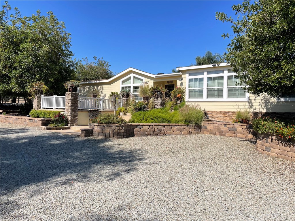 31451 Byers Road Menifee, CA 92584 - Photo 1 of 1 a front view of a house with a yard and garage