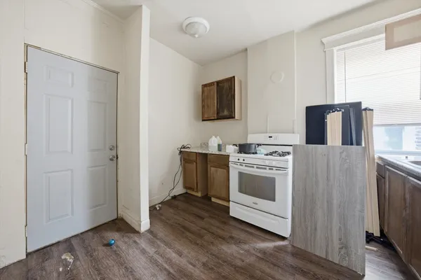 a kitchen with stainless steel appliances granite countertop a stove and a sink