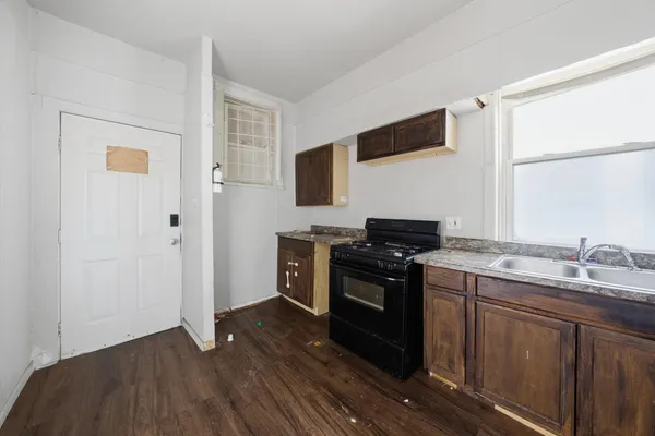 a kitchen with a stove and a refrigerator