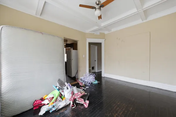 a view of room with window and wooden floor