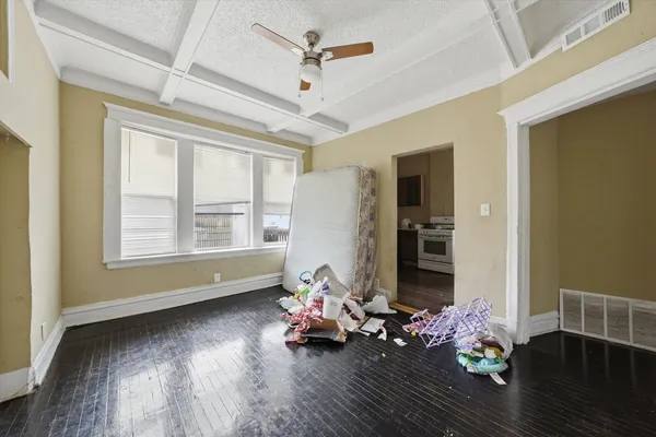 a room with furniture and wooden floor