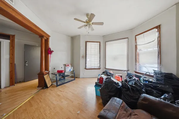 a bed room with furniture and window