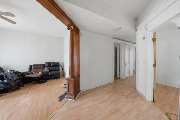 a view of a livingroom with hardwood floor and a window