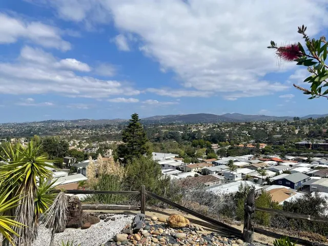 a view of a house with a yard and garage