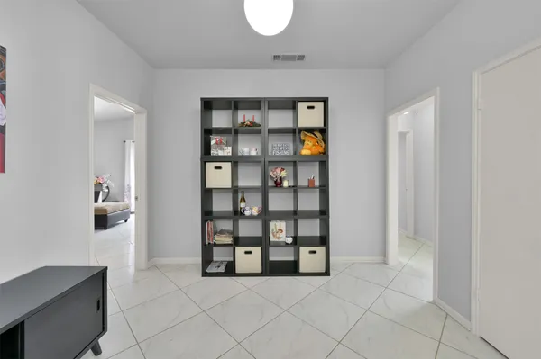 a view of an empty room with shelves