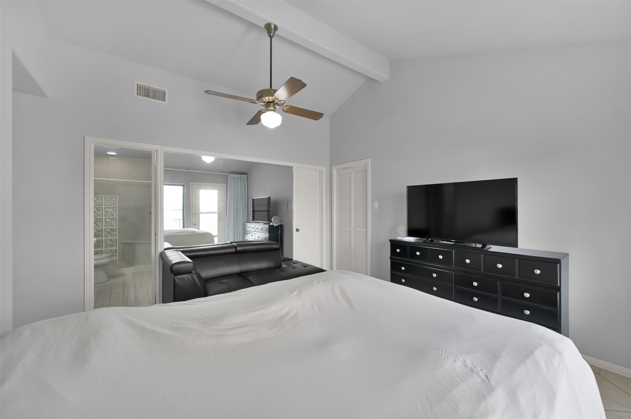 35 Lakeview Village Conroe, TX 77356 - Photo 13 of 34 a bedroom with a bed and a flat screen tv