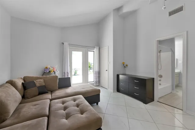 a living room with furniture and a couch