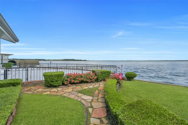 a view of a garden with lawn chairs