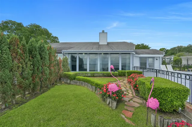 a front view of house with yard and seating area