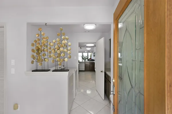 a view of a hallway and dining room