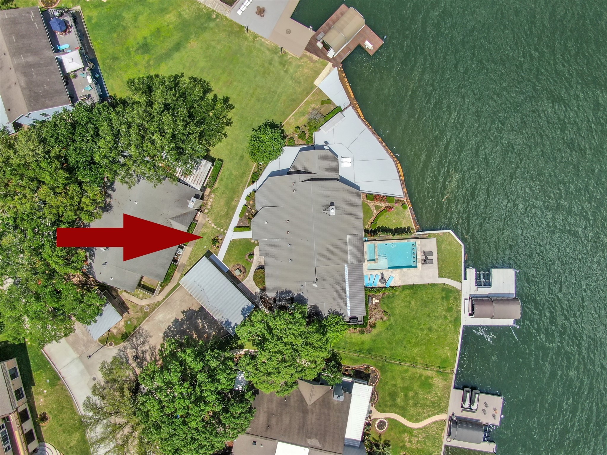 35 Lakeview Village Conroe, TX 77356 - Photo 34 of 34 an aerial view of a house with a yard and seating space