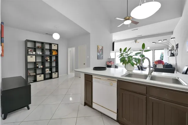 a kitchen with a sink and cabinets