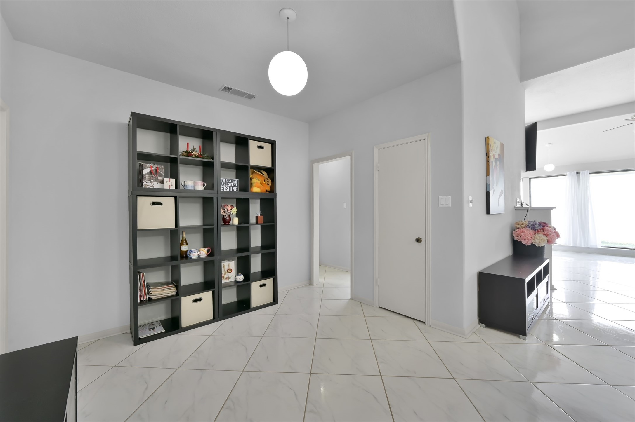 35 Lakeview Village Conroe, TX 77356 - Photo 9 of 34 a view of an empty room with cabinet and a window