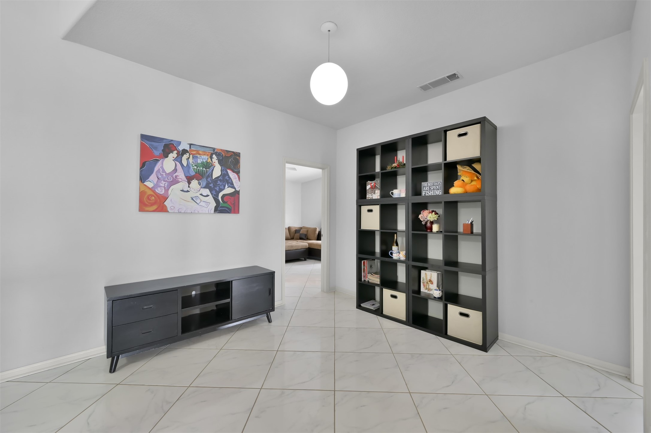 35 Lakeview Village Conroe, TX 77356 - Photo 10 of 34 a view of an empty room with shelves and book shelf