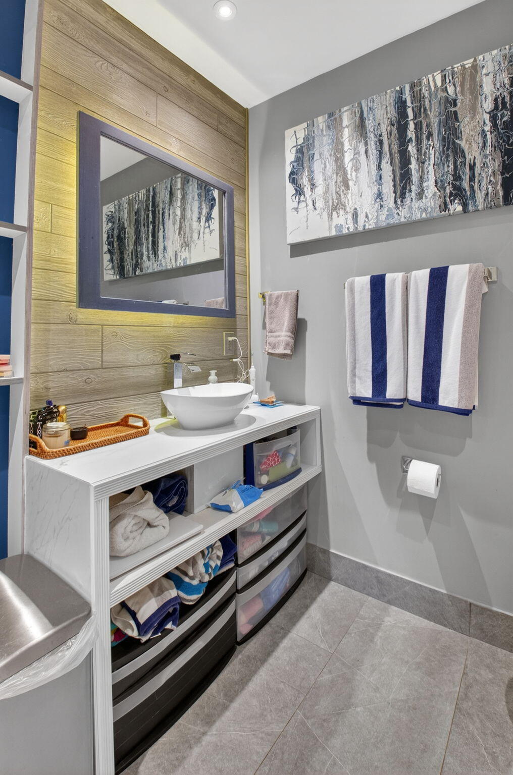 233 Northeast 12th Street Delray Beach, FL 33444 - Photo 20 of 55 a bathroom with a sink a mirror and a painting on the wall
