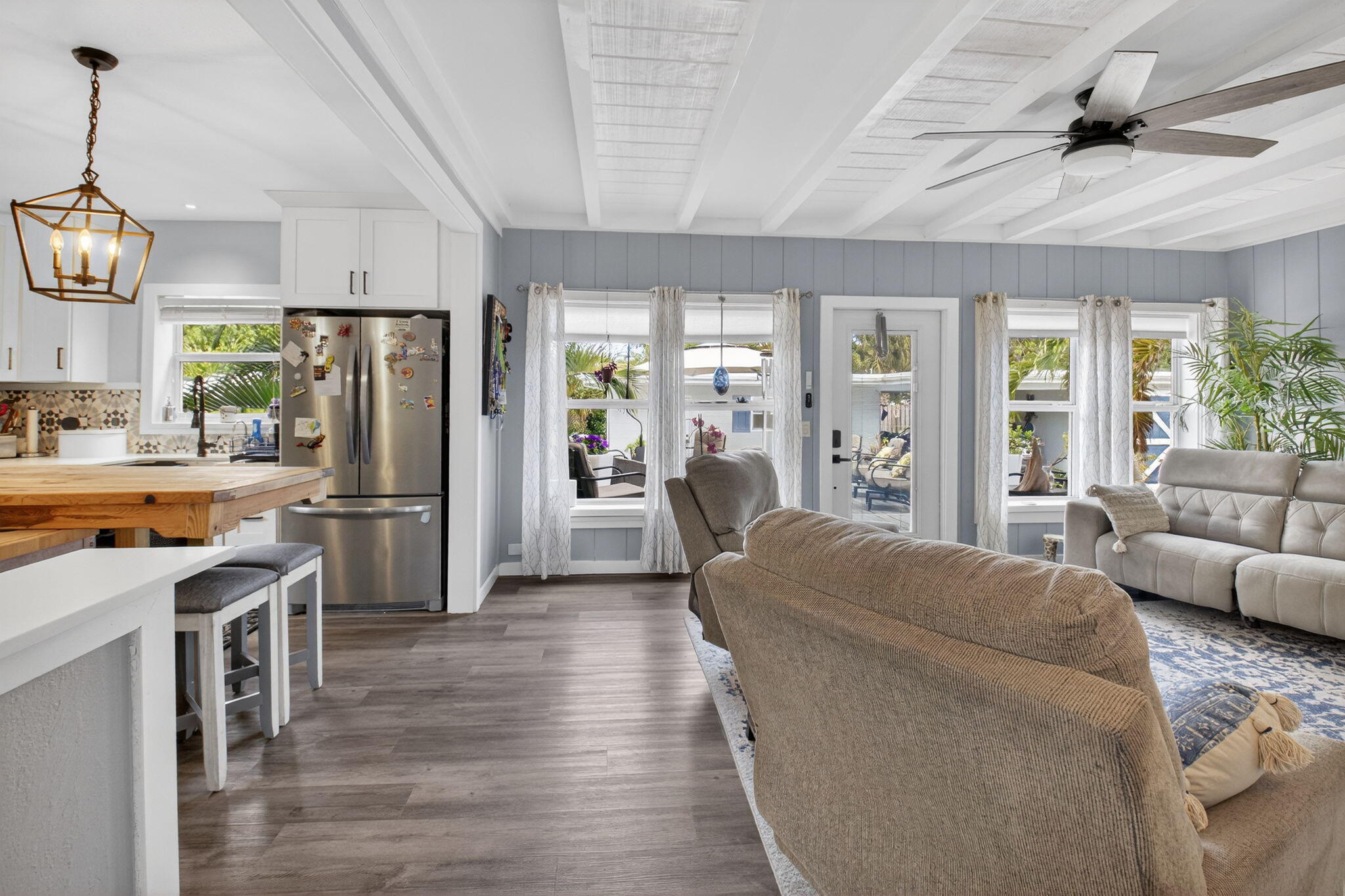 233 Northeast 12th Street Delray Beach, FL 33444 - Photo 22 of 55 a living room with stainless steel appliances furniture a flat screen tv and a large window