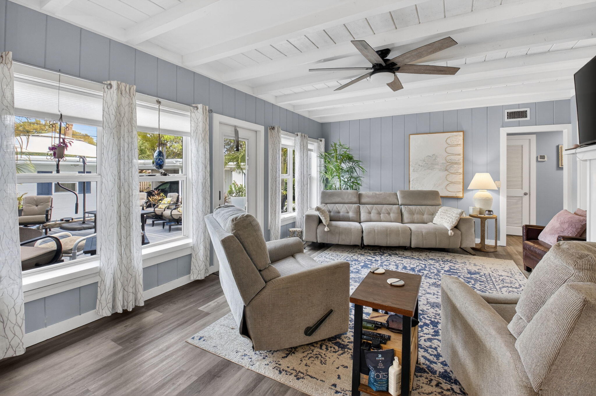 233 Northeast 12th Street Delray Beach, FL 33444 - Photo 23 of 55 a living room with furniture and a large window with wooden floor