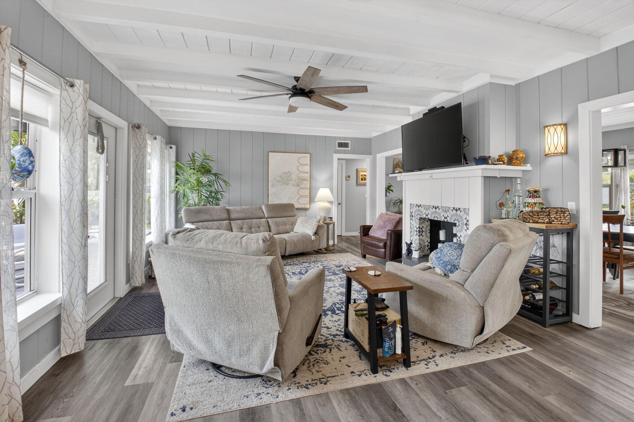 233 Northeast 12th Street Delray Beach, FL 33444 - Photo 24 of 55 a living room with furniture a fireplace and a large window