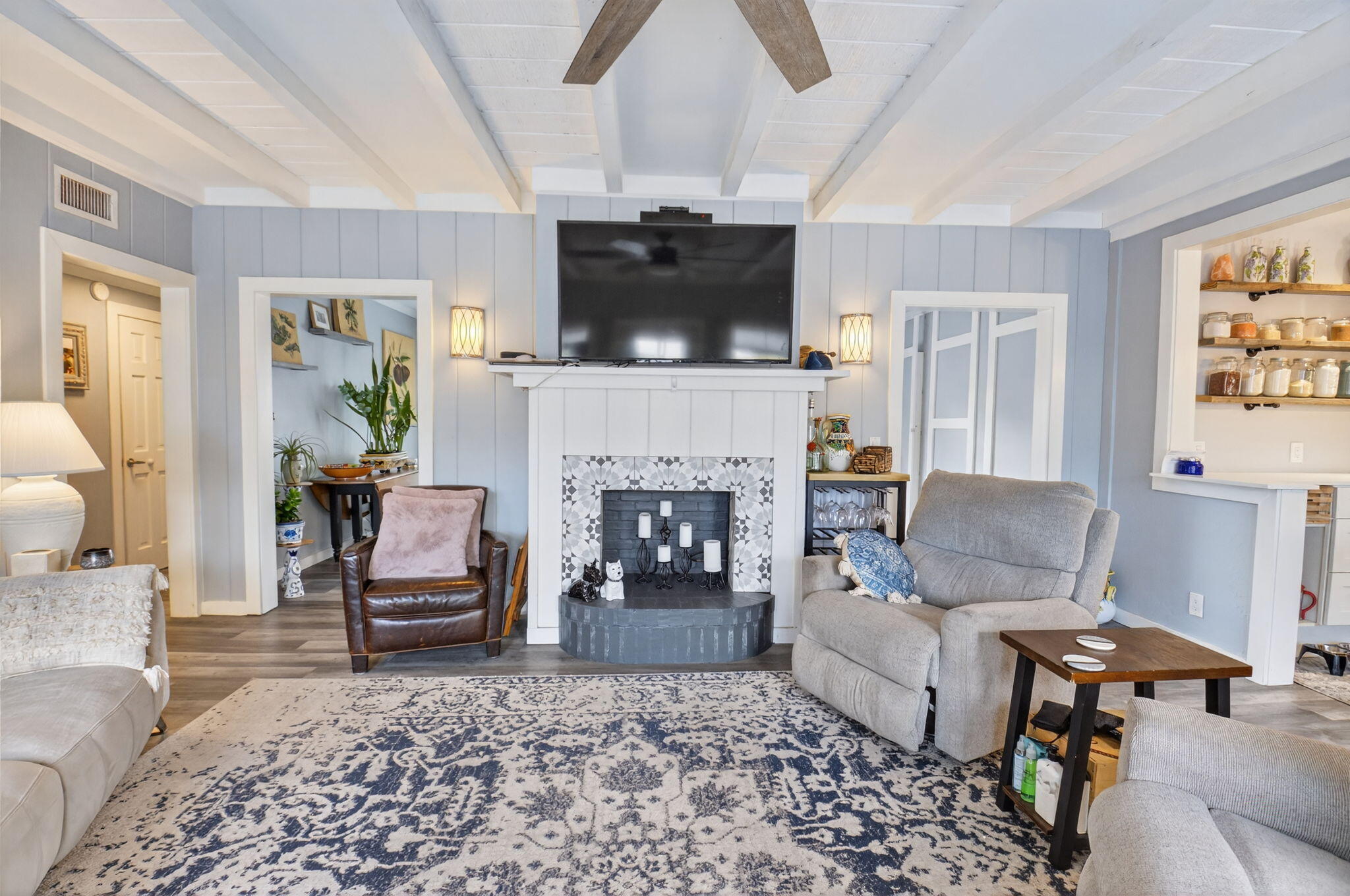 233 Northeast 12th Street Delray Beach, FL 33444 - Photo 25 of 55 a living room with furniture a flat screen tv and a fireplace