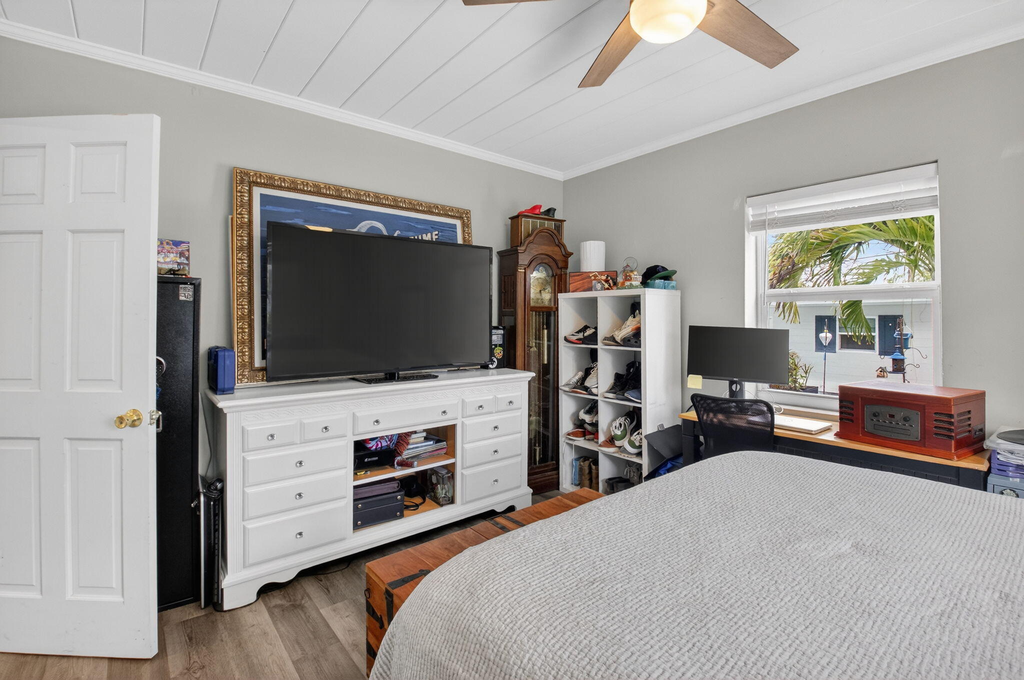 233 Northeast 12th Street Delray Beach, FL 33444 - Photo 34 of 55 a bedroom with furniture and a flat screen tv