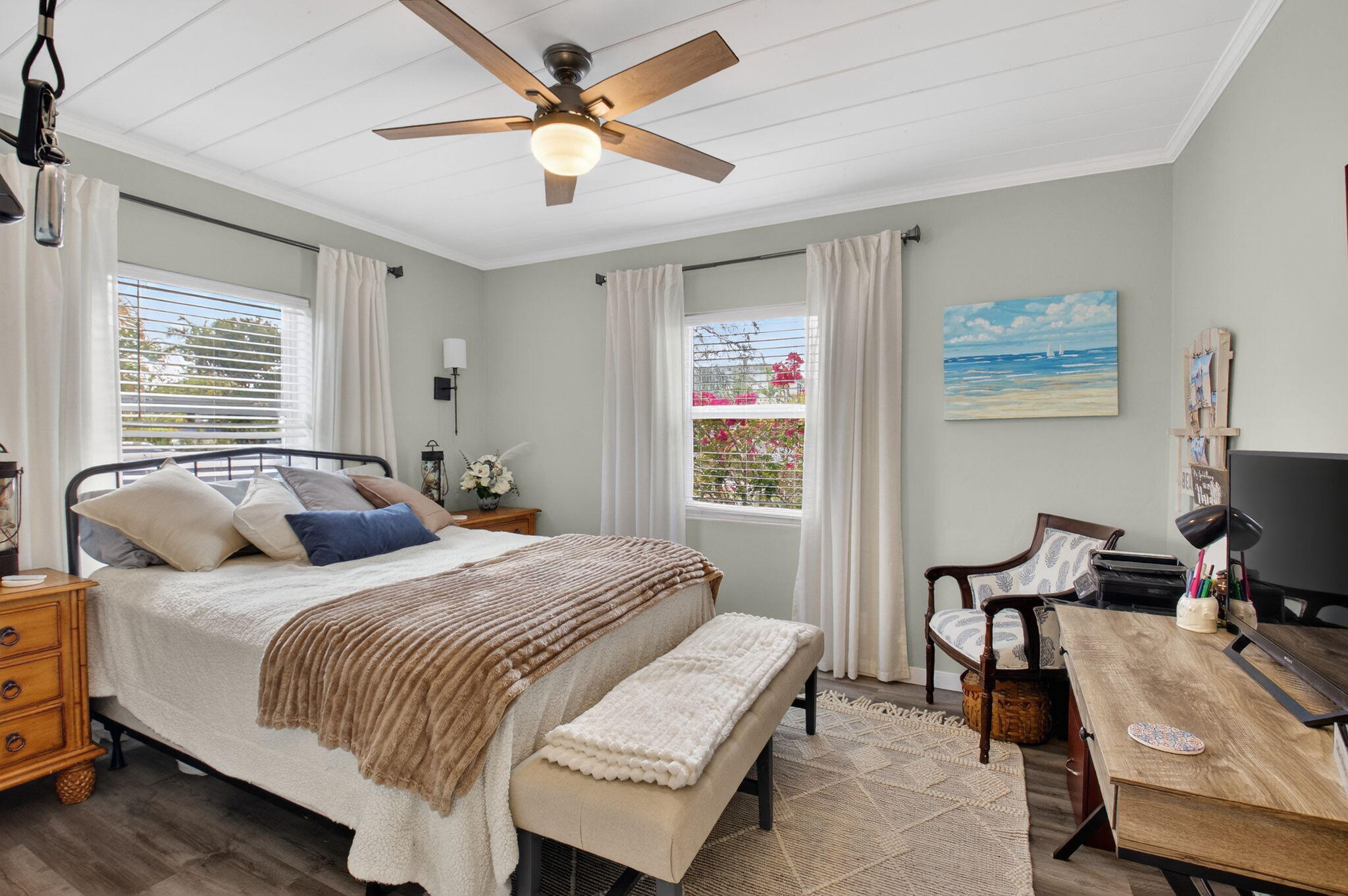 233 Northeast 12th Street Delray Beach, FL 33444 - Photo 35 of 55 a bedroom with a bed and a chandelier