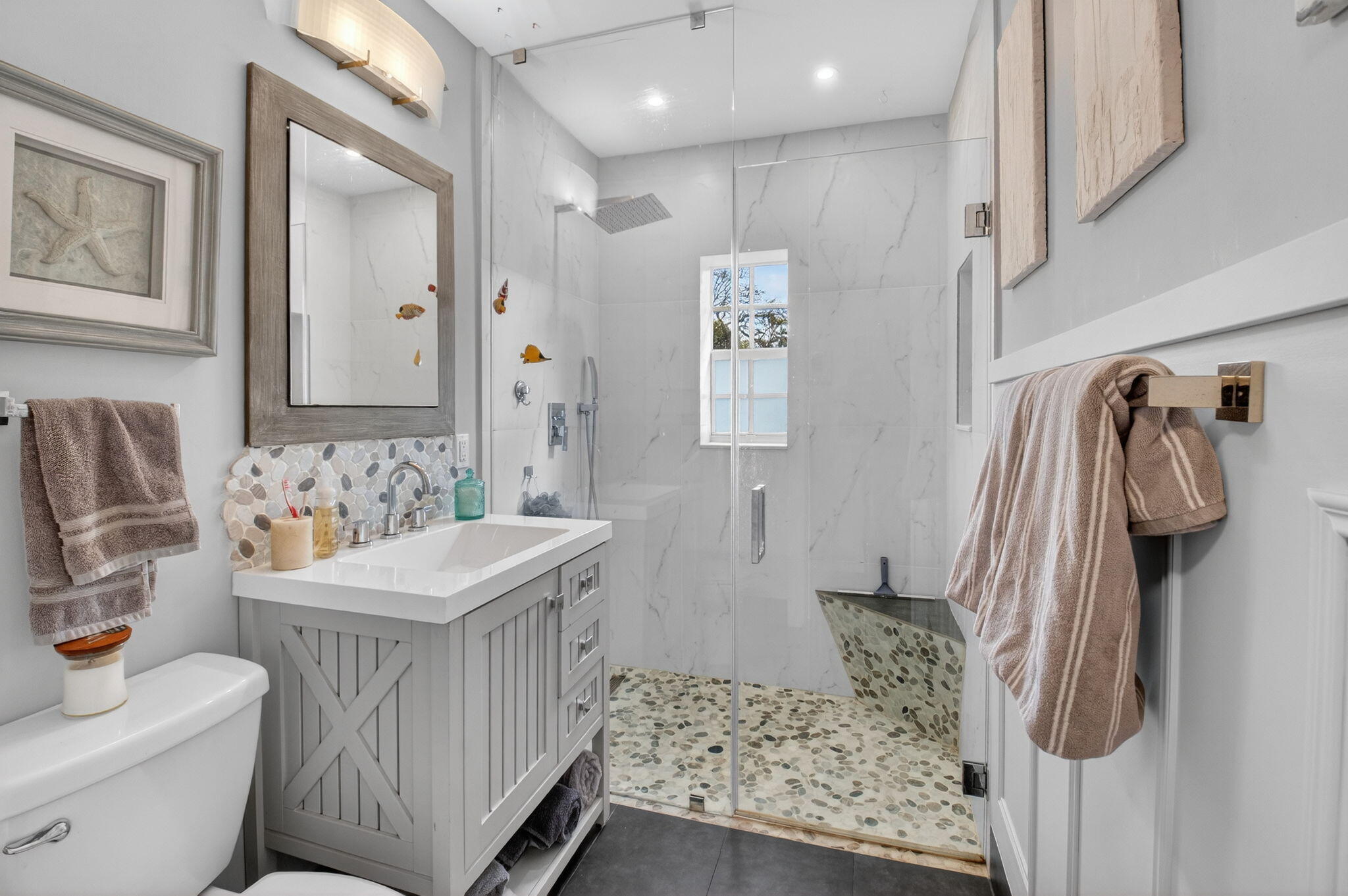 233 Northeast 12th Street Delray Beach, FL 33444 - Photo 37 of 55 a bathroom with a sink toilet and shower