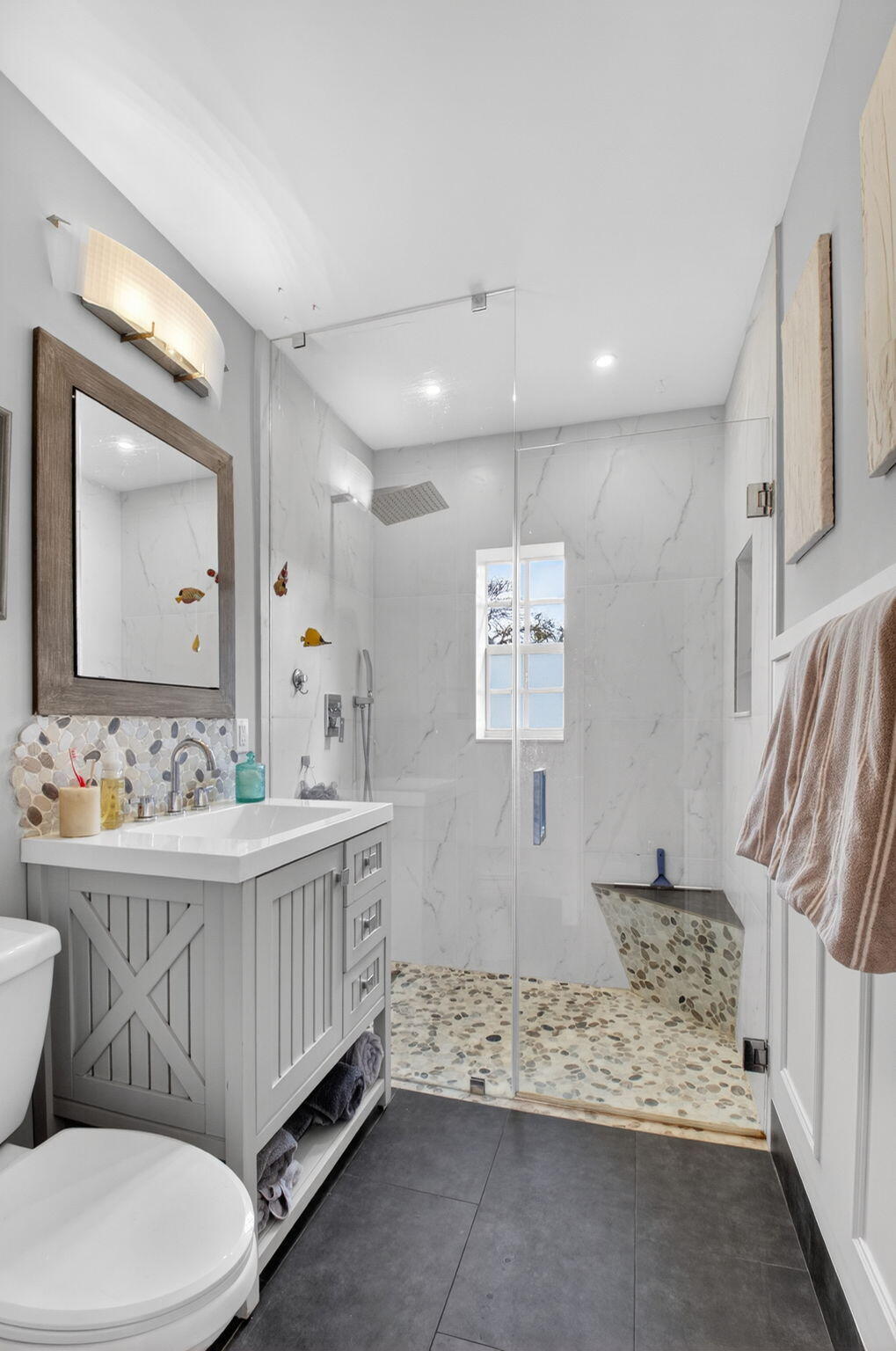 233 Northeast 12th Street Delray Beach, FL 33444 - Photo 38 of 55 a bathroom with a double vanity sink mirror and toilet