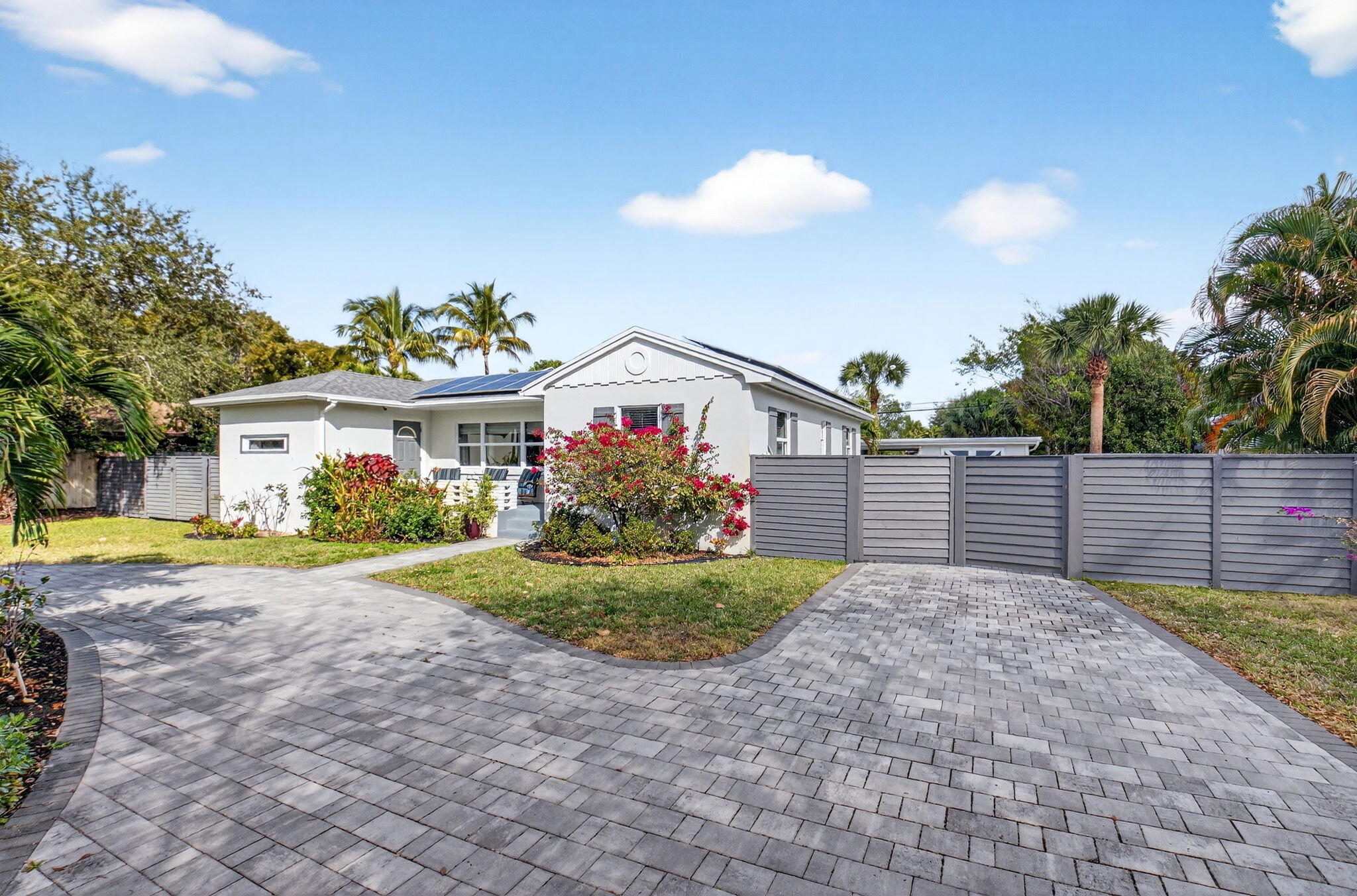 233 Northeast 12th Street Delray Beach, FL 33444 - Photo 4 of 55 a view of a backyard with a garden and plants