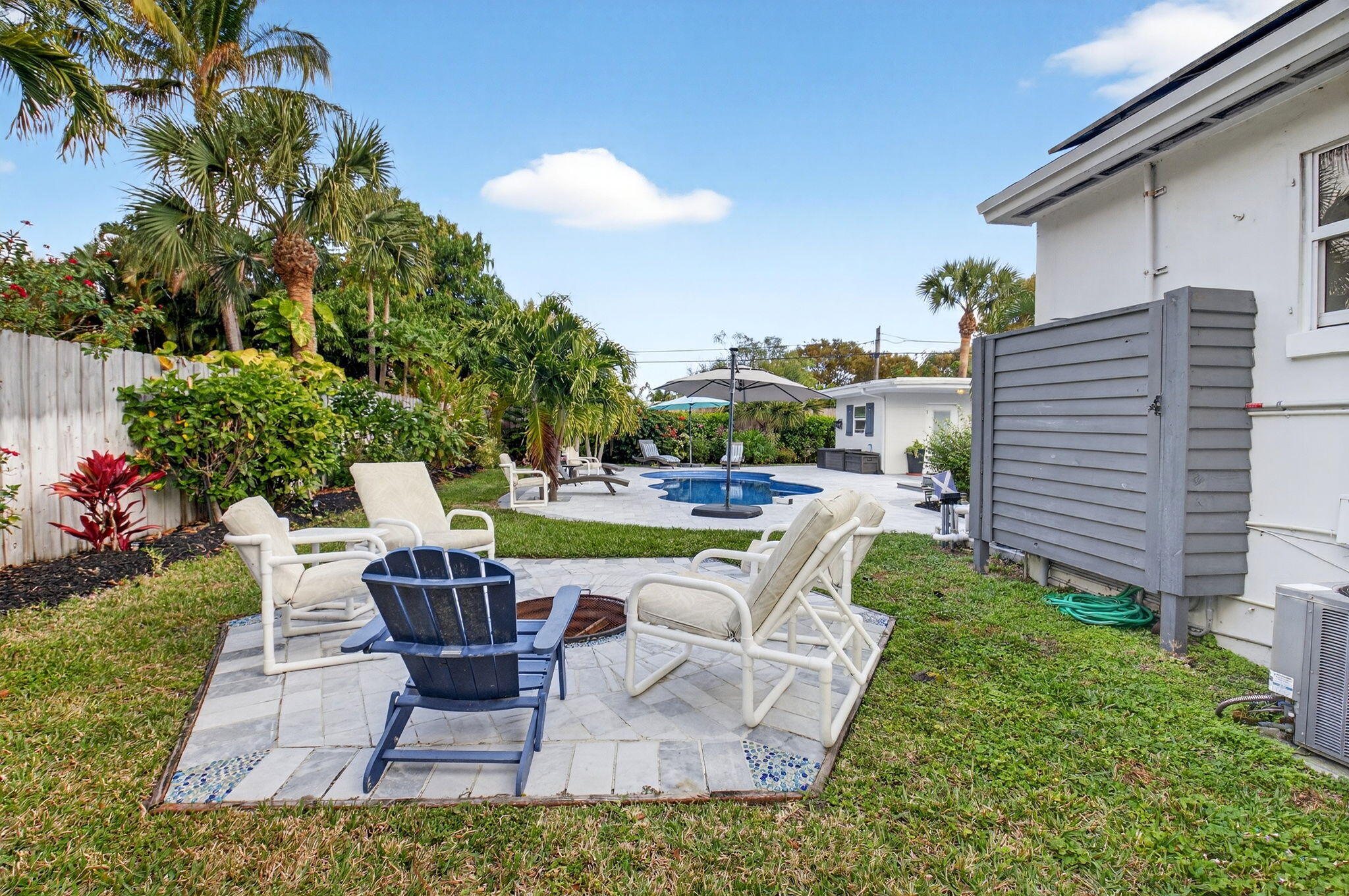 233 Northeast 12th Street Delray Beach, FL 33444 - Photo 49 of 55 a swimming pool with outdoor seating and yard