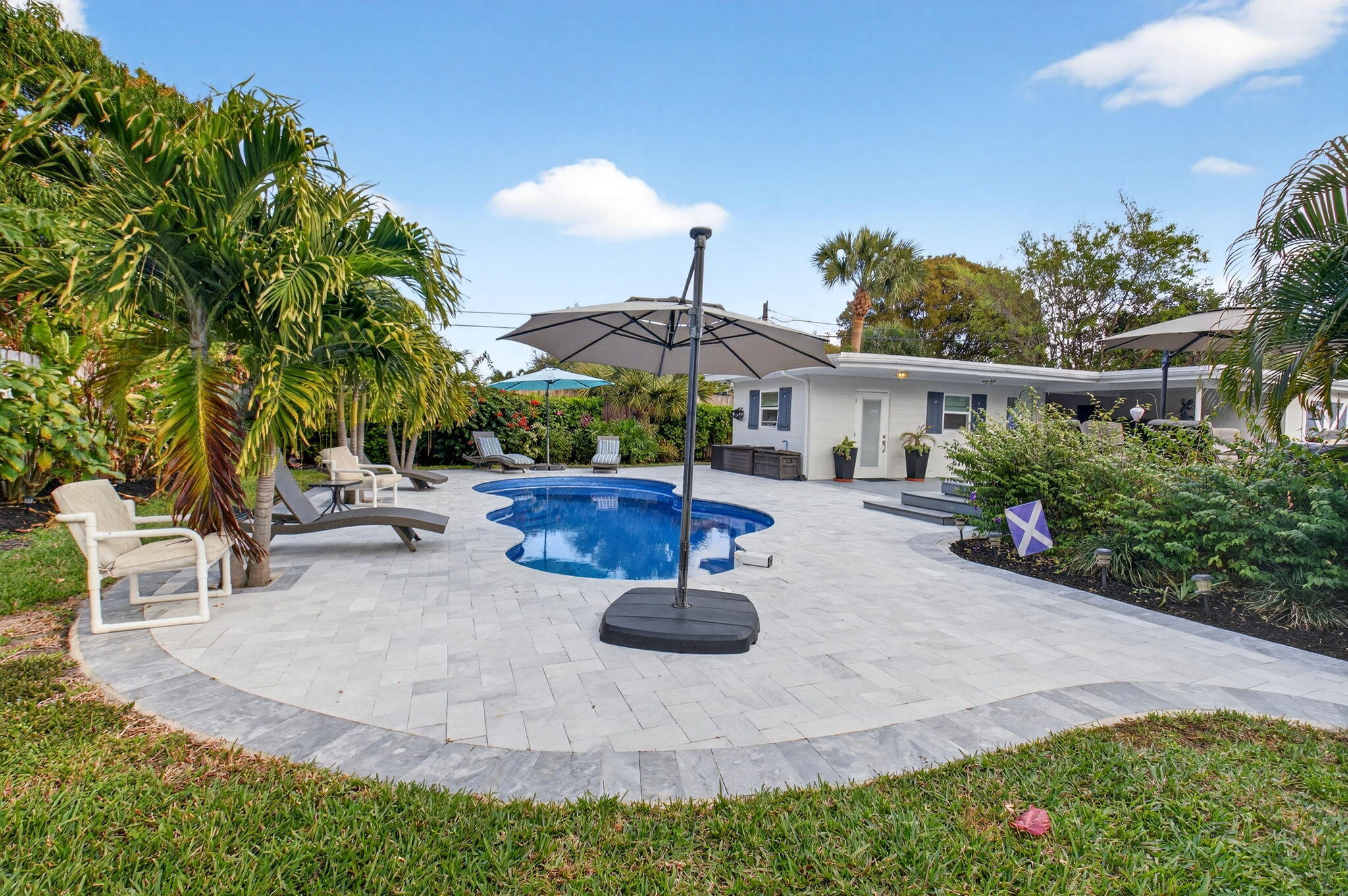 233 Northeast 12th Street Delray Beach, FL 33444 - Photo 50 of 55 a view of a backyard with sitting area