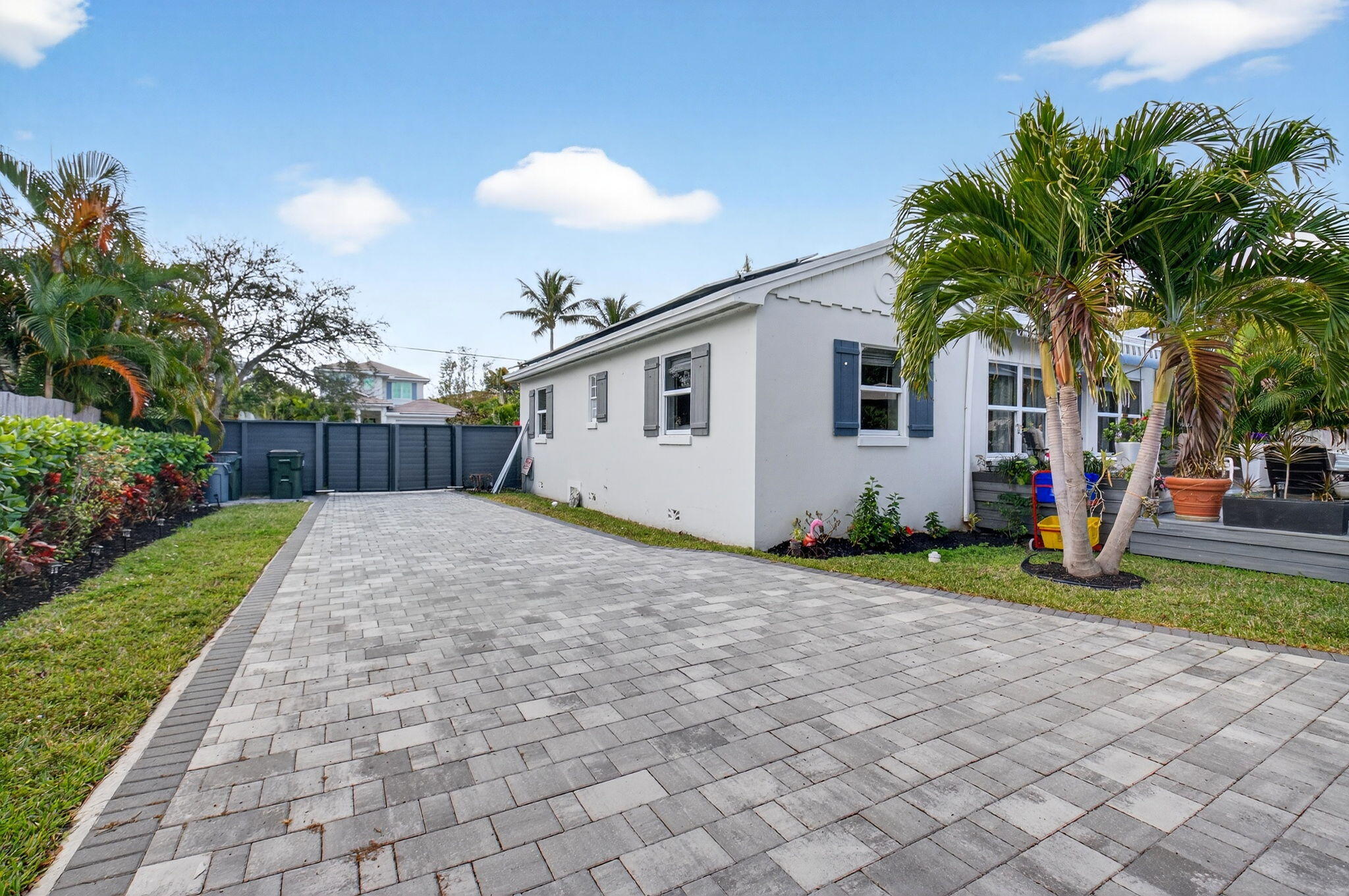 233 Northeast 12th Street Delray Beach, FL 33444 - Photo 52 of 55 a front view of house with yard and trees around