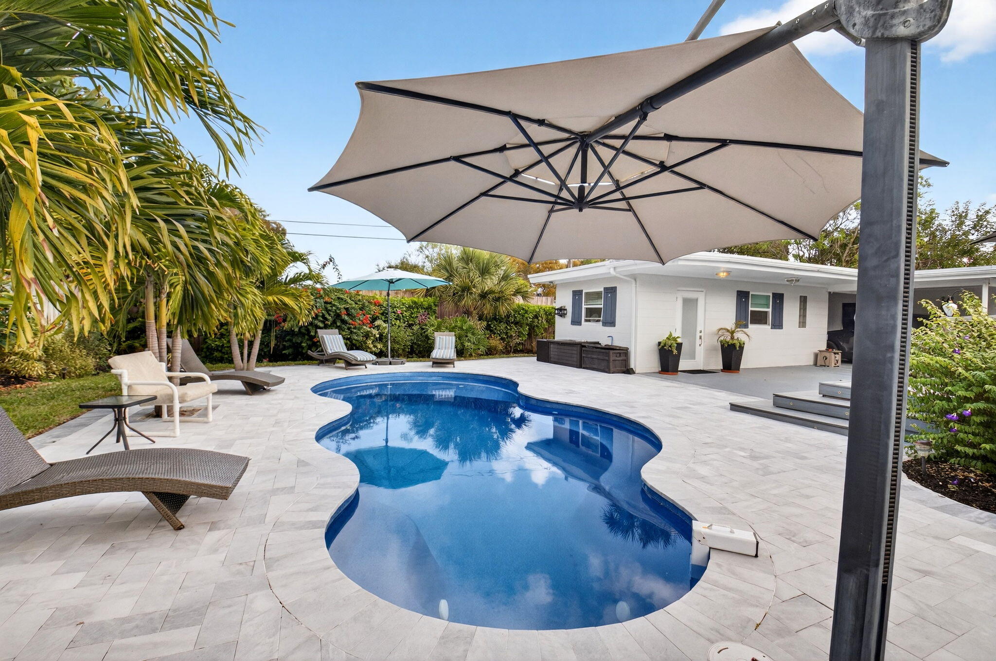 233 Northeast 12th Street Delray Beach, FL 33444 - Photo 53 of 55 a view of a swimming pool with a patio