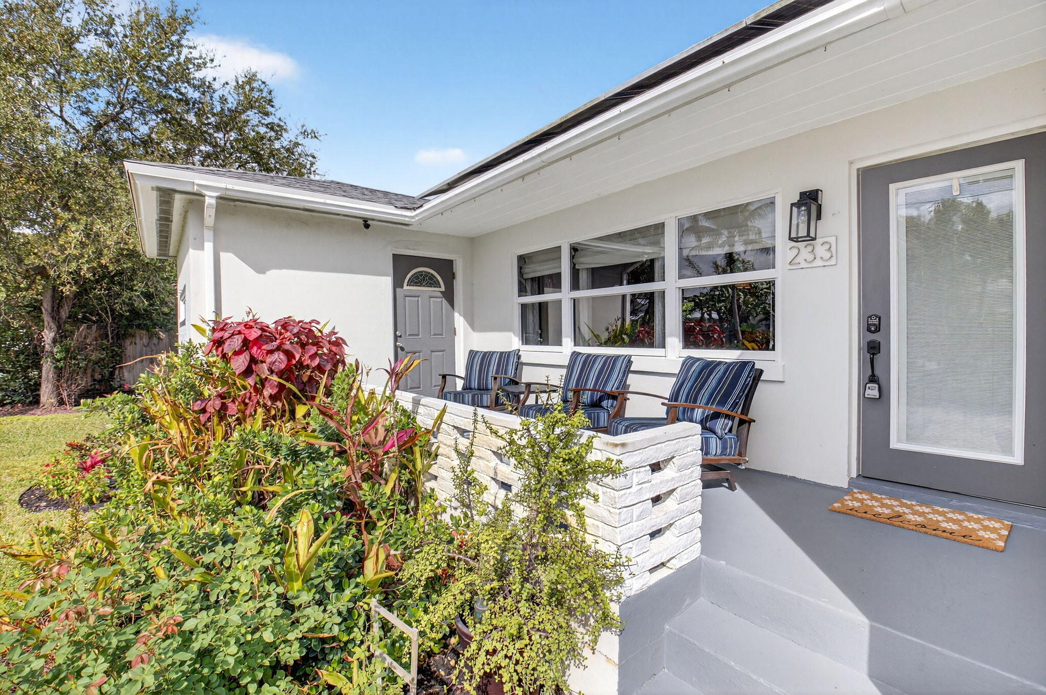 233 Northeast 12th Street Delray Beach, FL 33444 - Photo 10 of 55 a view of a patio with table and chairs and potted plants