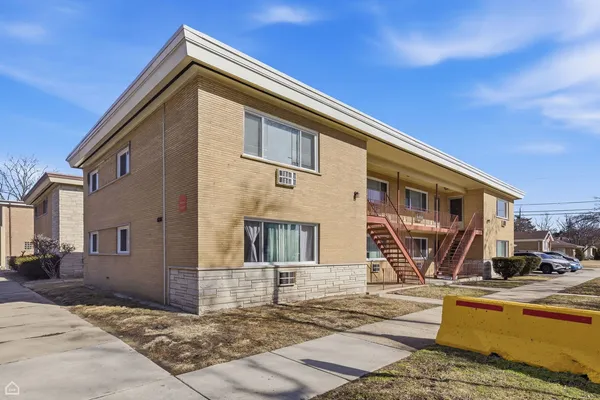 a front view of a house with parking area