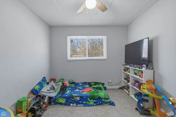 a room with toys and a flat screen tv