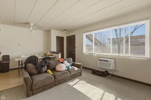 a living room with furniture and a window