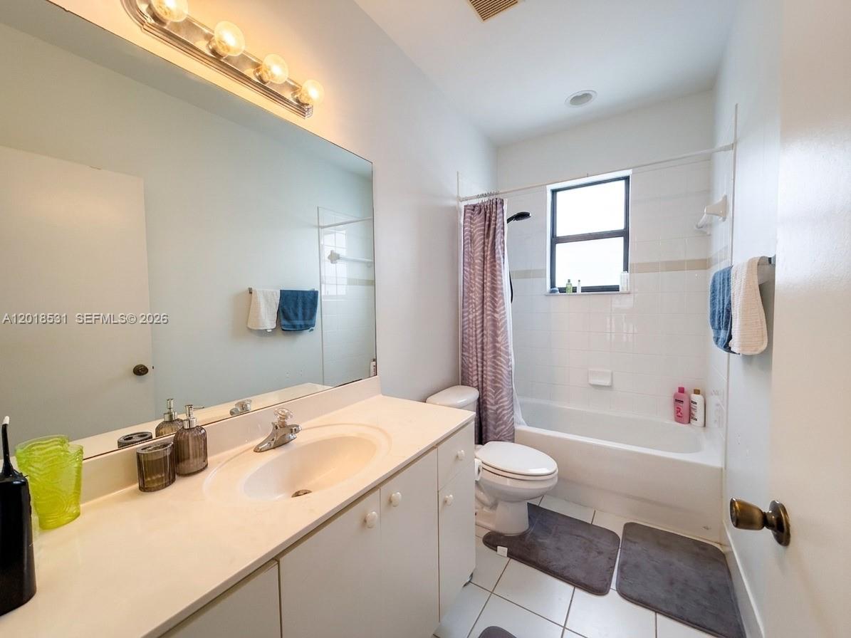 1575 Southeast 20th Road Homestead, FL 33035 - Photo 13 of 19 a bathroom with a sink a toilet and shower
