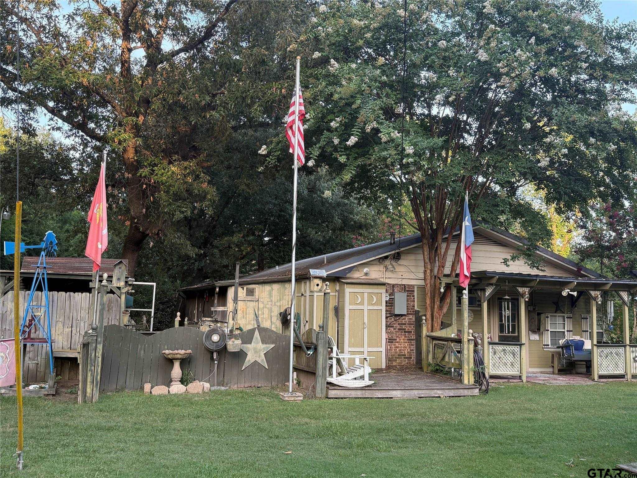 412 South Birch Street Van, TX 75790 - Photo 7 of 9 a front view of a house with garden