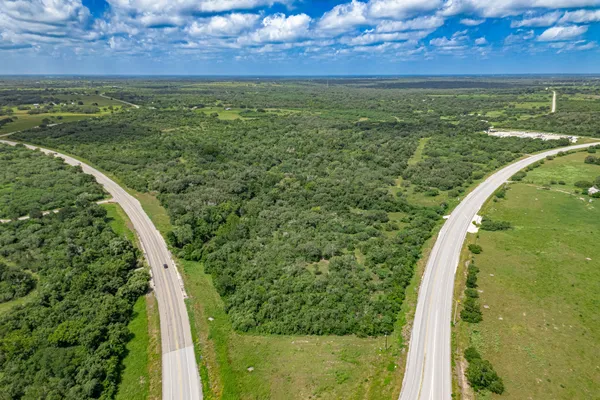 a view of a yard with a swimming pool